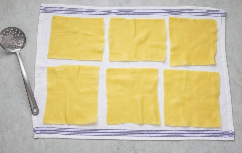 Ham and Mushroom Lasagna Pinwheels, step 4: blanched lasagna sheets drying on a towel