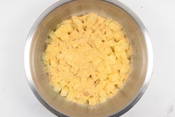Drained potatoes with breadcrumbs in a bowl