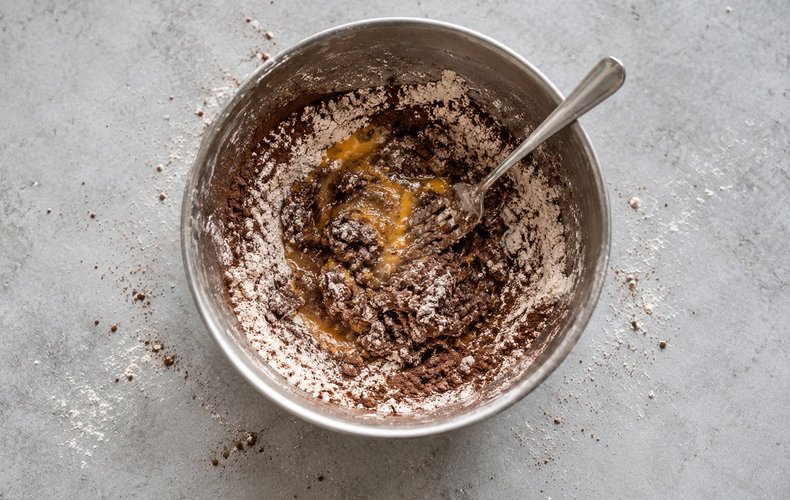 Kneading flour, cocoa and eggs for the cocoa tagliatelle