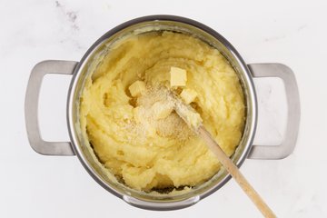 Homemade Mashed Potatoes, step 5: stirring in the butter and grated cheese