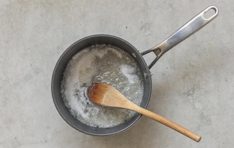 Homemade Soft Caramels, step 1: sugar melting in a small saucepan