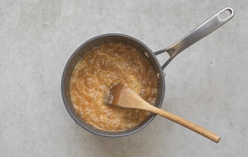 Homemade Soft Caramels, step 2: cream stirred into the amber caramel