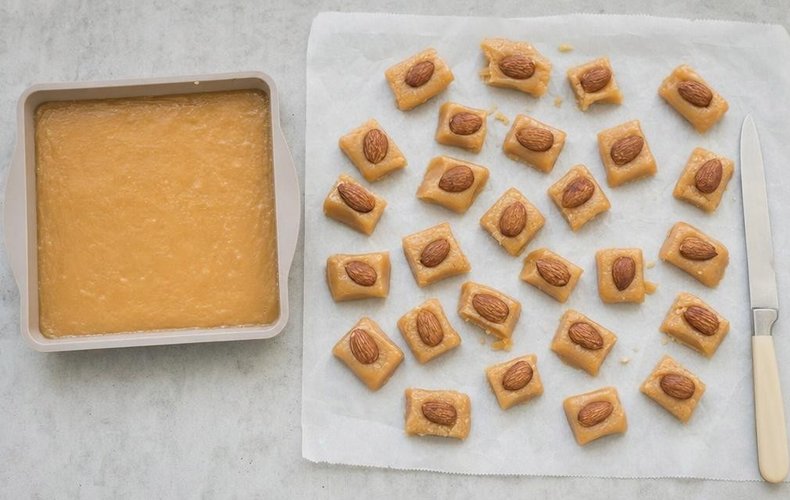 Homemade Soft Caramels, step 5: caramels cut and topped with almonds