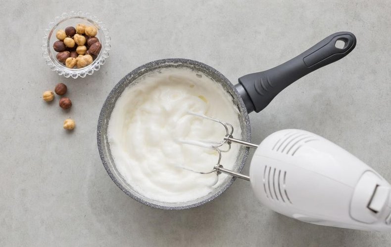 Homemade Soft Torrone, step 4: whipped egg white mixed into the honey mixture