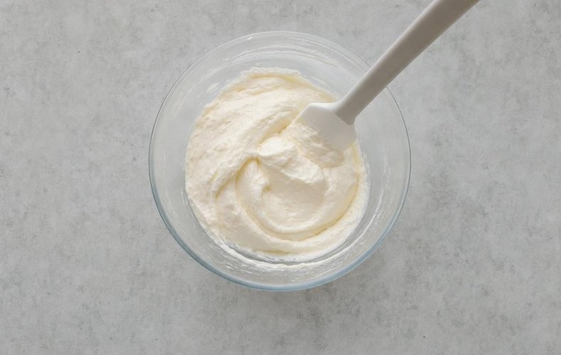 Lemon Mousse, step 3: folding the whipped cream into the meringue