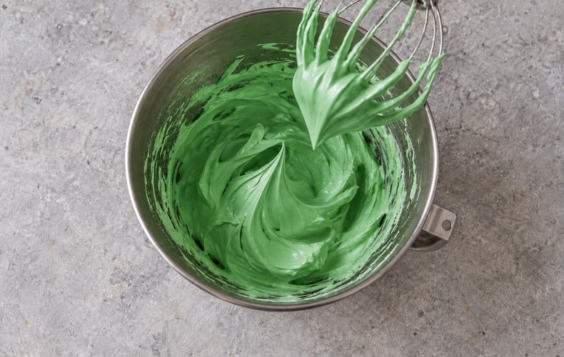 Meringue Christmas Trees, step 2: green meringue whipped with powdered sugar