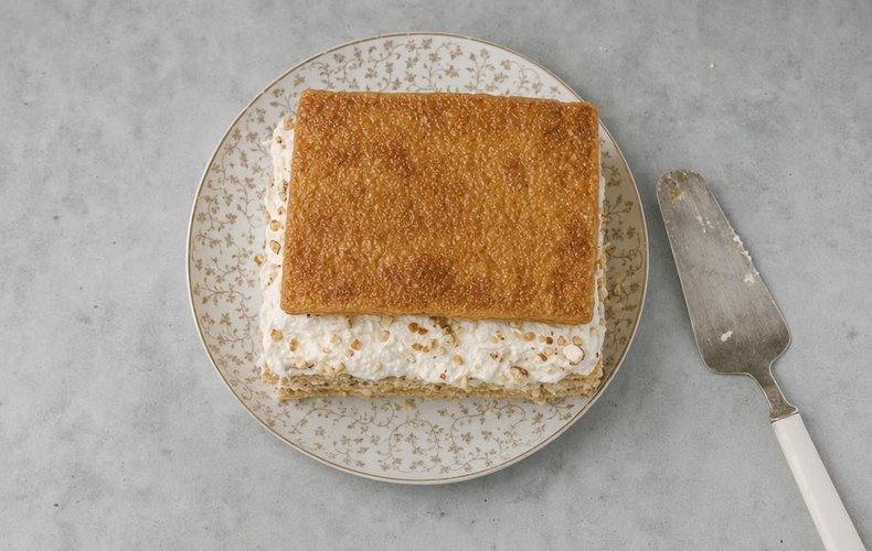 Millefeuille Cake with Torrone Cream, step 6: pastry layered with torrone cream and chopped hazelnuts