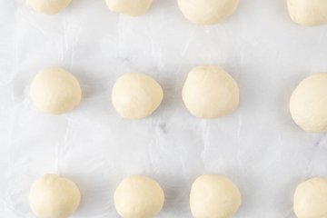 Folding the edges of the dough disks toward the center