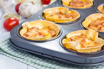 Mini lasagna cupcakes in a muffin pan