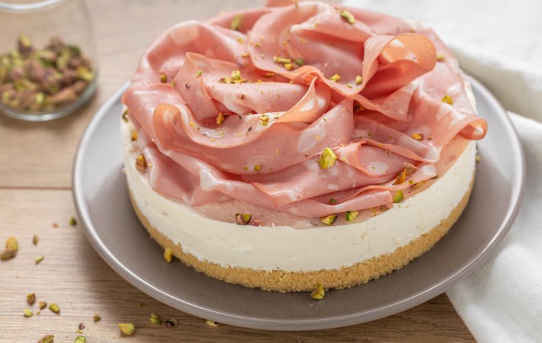 Savory mortadella cheesecake with pistachios
