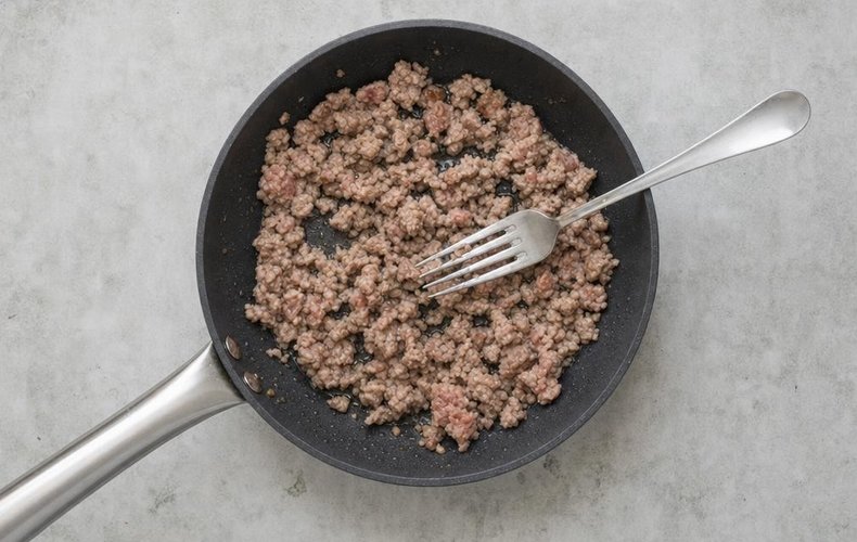 Mushroom Cannelloni, step 4: crumbled sausage browning in a skillet