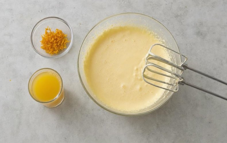 No-Rise Pandoro, step 1: egg yolks beaten with sugar, orange zest and freshly squeezed orange juice