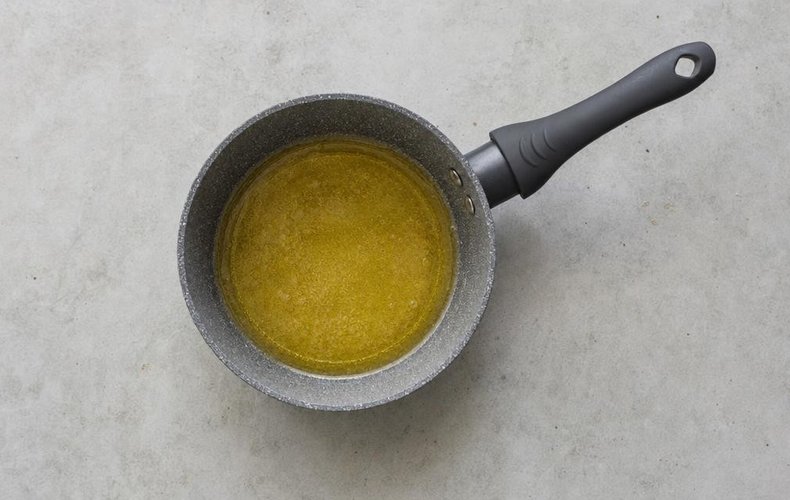 Nougat Wafer Bites, step 1: sugar and honey melting in a saucepan