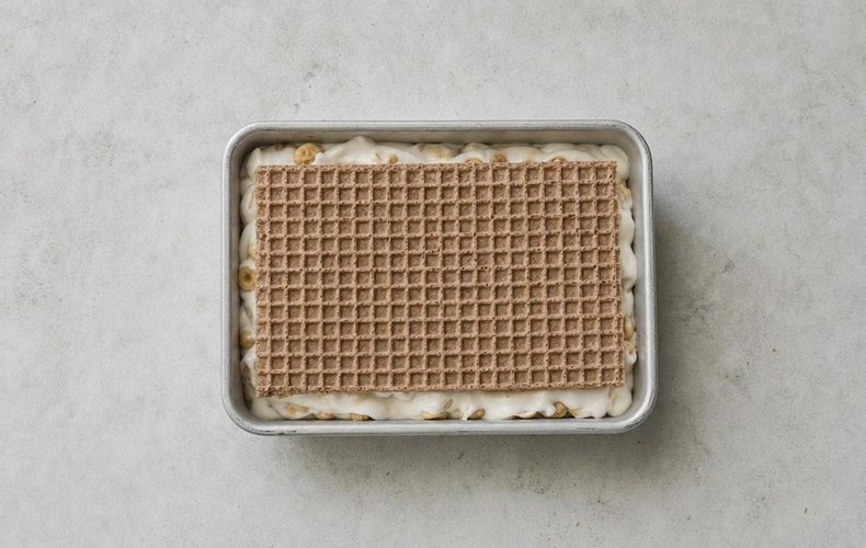 Nougat Wafer Bites, step 5: nougat spread between layers of wafer in the pan