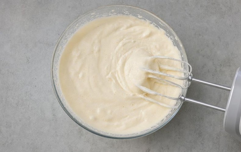 Beating the eggs and sugar until pale and foamy