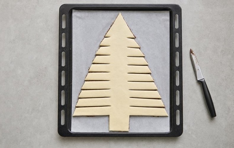 Nutella Puff Pastry Christmas Tree, step 3: horizontal cuts on both sides of the central trunk