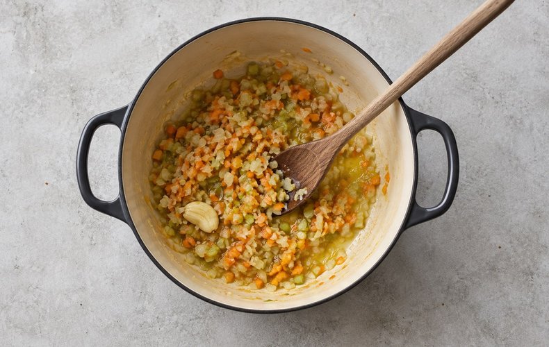 Pappardelle with Wild Boar Ragù, step 1: chopped carrot, celery and onion sautéing in a pot