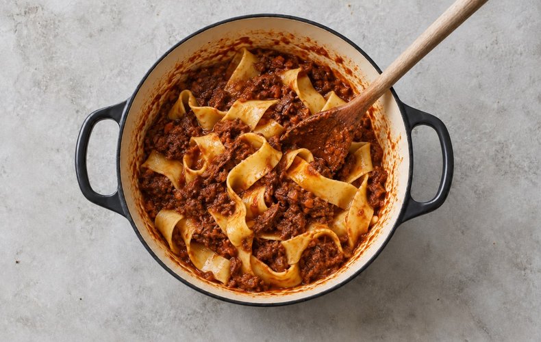 Pappardelle with Wild Boar Ragù, step 5: pappardelle tossed with the ragù in the pot