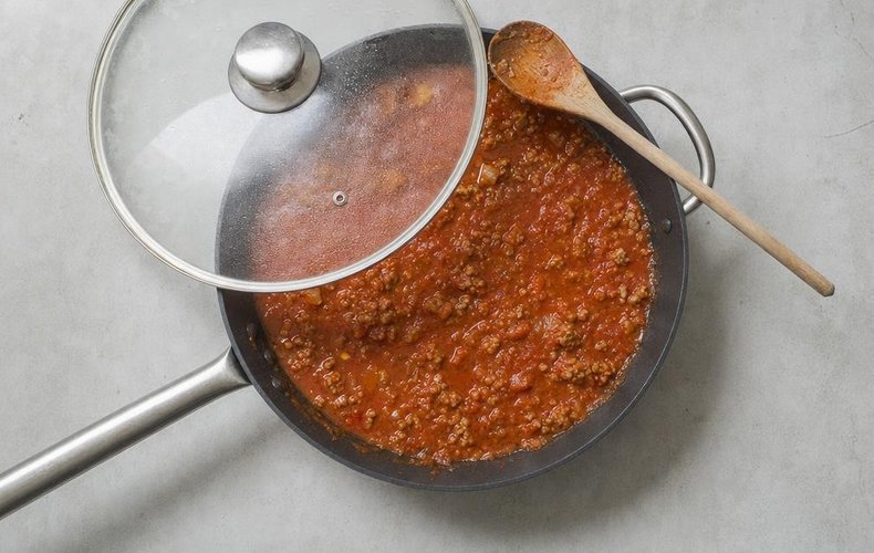 Pasta alla Carcerata, step 5: sausage and tomato sauce simmering in the pan