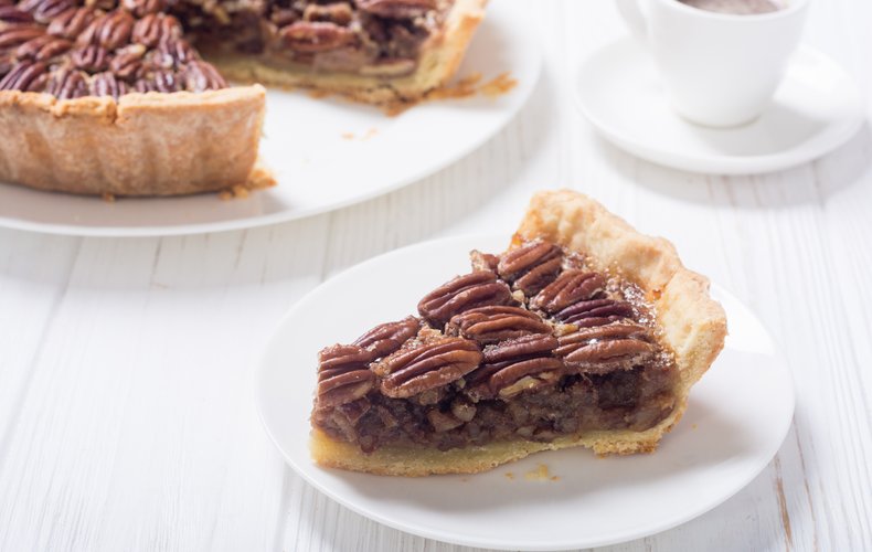 Pecan pie topped with whole pecans