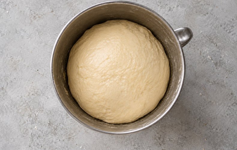 Pesto Bread Wreath, step 3: the ball of dough rising in an oiled bowl