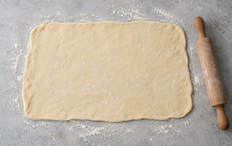 Pesto Bread Wreath, step 4: rolling the dough out into a thin rectangle