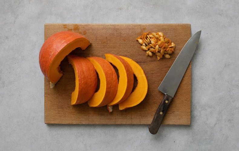 Phyllo Cups with Pumpkin, Speck and Taleggio, step 1: pumpkin cut into thick slices with the seeds removed