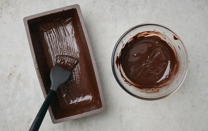 Pistachio Torrone, step 1: mold coated with melted dark chocolate