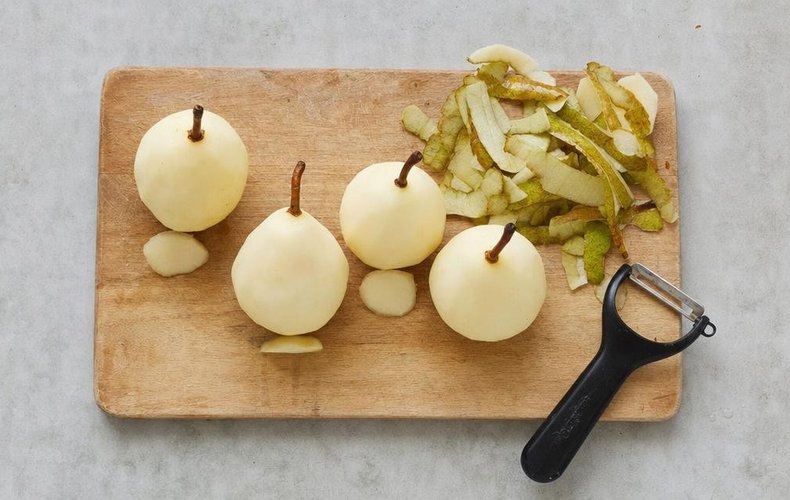 Poached Pears with Coffee Caramel Sauce, step 2: peeled pears with the stem on and a flat base
