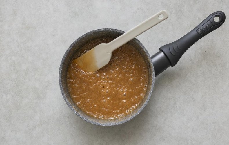 Poached Pears with Coffee Caramel Sauce, step 4: coffee caramel sauce cooking in a saucepan