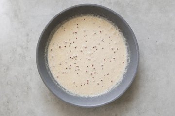 Pork Tenderloin with Pink Peppercorns, step 2: cream and pink peppercorns added to the skillet