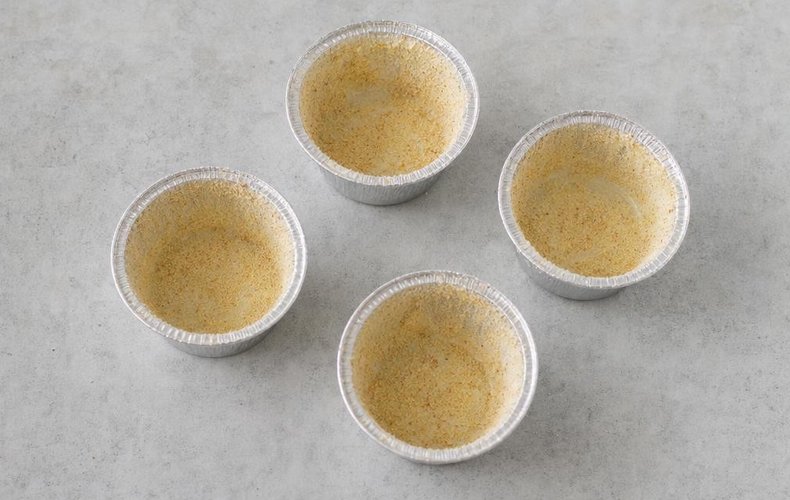 Potato and Mushroom Timbales, step 5: buttered molds coated with breadcrumbs