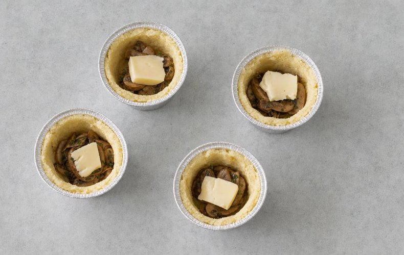 Potato and Mushroom Timbales, step 6: filling the potato shells with mushrooms and provola