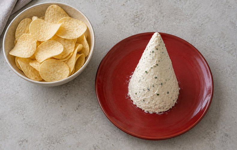 Potato Chip Christmas Tree, step 5: chilled cheese cone standing upright on the serving platter