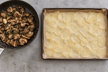 Potato, Mushroom and Scamorza Roll, step 3: overlapping potato slices on the Parmigiano