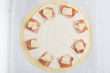 Adding scamorza to each wedge
