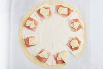 Brushing the edge of the pastry with water