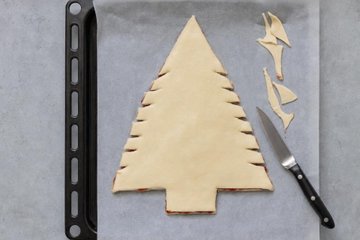 Puff Pastry Christmas Tree with Jam and Cinnamon, step 2: the second sheet of pastry laid on top and trimmed into a tree
