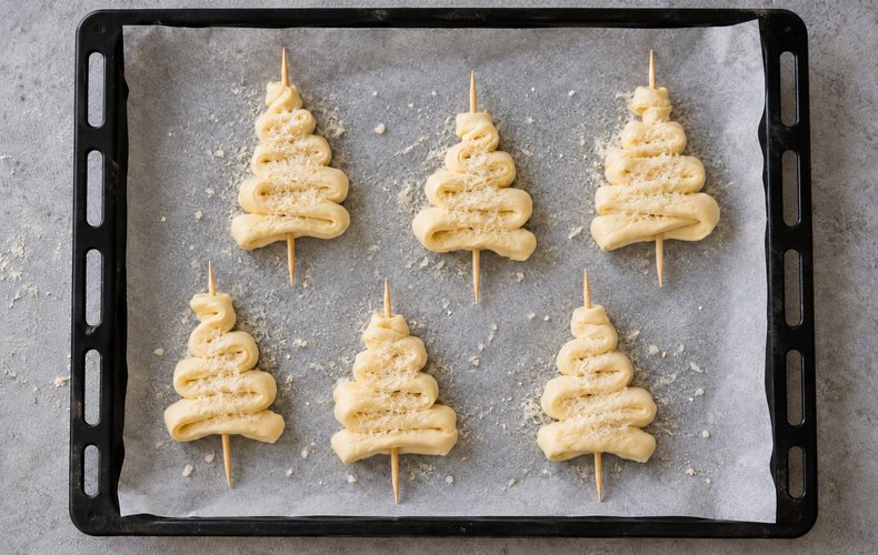 Puff Pastry Christmas Tree Place Cards, step 3: the trees sprinkled with grated Parmigiano and pecorino
