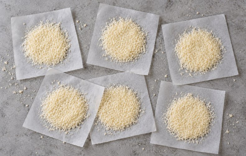 Puff Pastry Christmas Tree Place Cards, step 4: circles of grated Parmigiano on squares of parchment paper