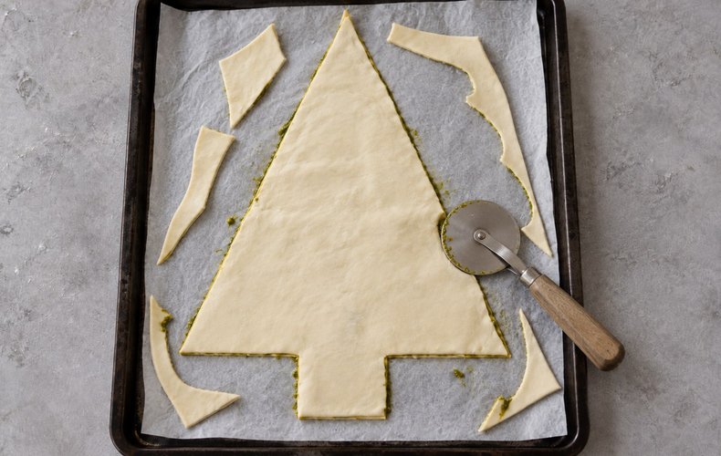 Puff Pastry Christmas Tree, step 3: the second sheet laid on top and trimmed to the tree shape