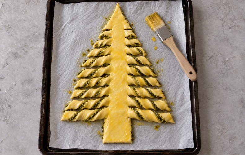 Puff Pastry Christmas Tree, step 5: the branches twisted and brushed with egg yolk