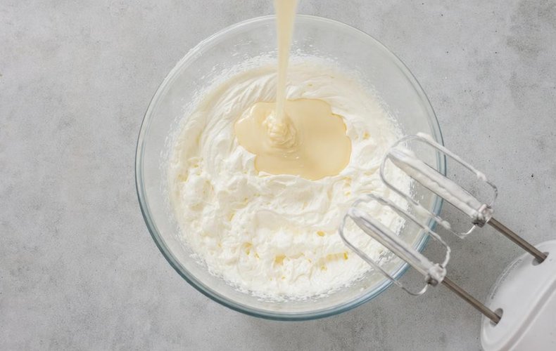 Quick and Easy Zuccotto, step 2: whipping the cream with condensed milk