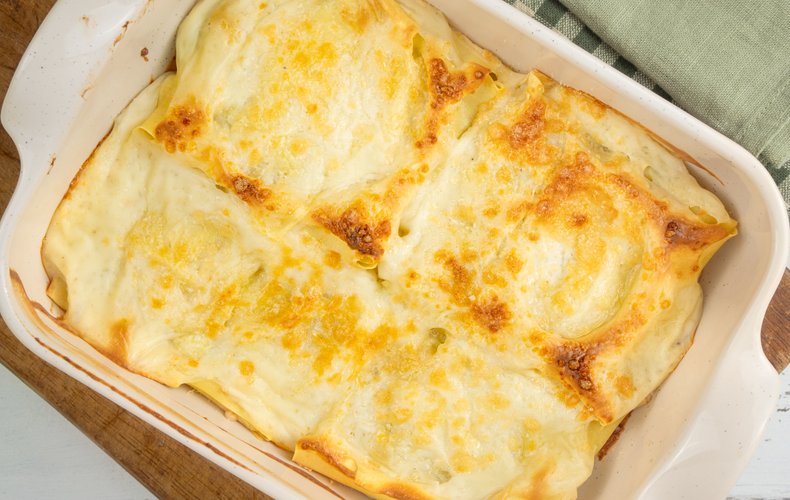 Ricotta and spinach lasagna bundles in a baking dish