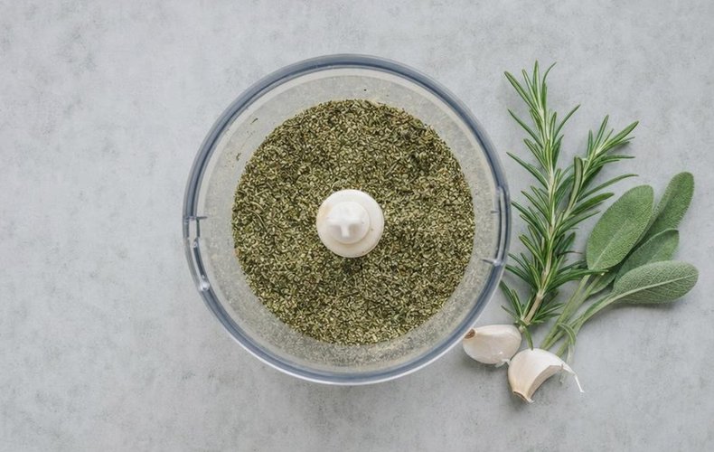 Roast Fresh Ham, step 2: rosemary, sage and garlic blended in a food processor