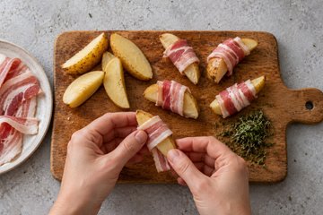 Roasted Potatoes with Pancetta, step 2: potato wedges wrapped in pancetta