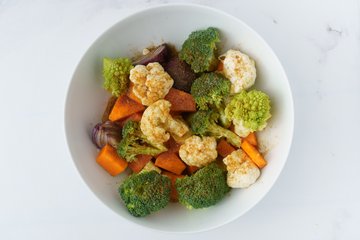 Vegetables on a baking sheet lined with parchment paper