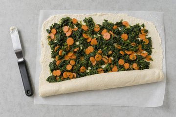 Rolled Chicken Meatloaf with Carrots and Spinach, step 3: rolling up the meatloaf around the vegetables