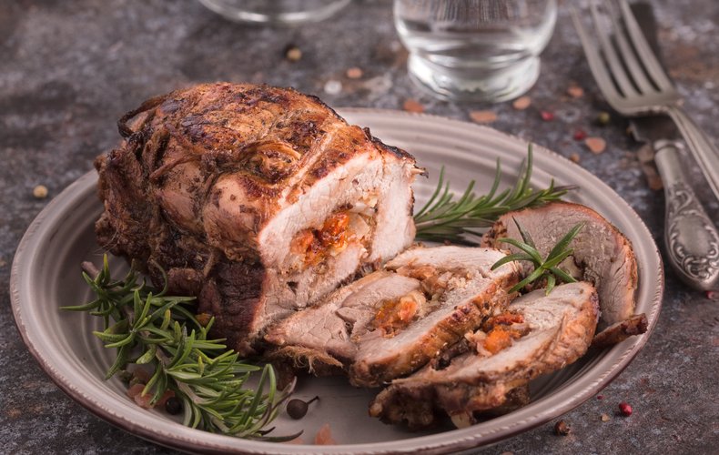 Rolled veal roast filled with dried apricots and walnuts