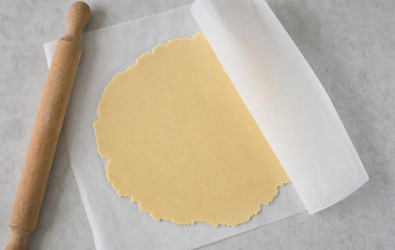 Russian Salad Tartlets, step 8: rolling out the dough between sheets of parchment paper